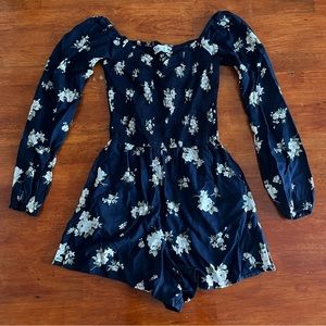 ‘Hollister’ navy and white off the shoulder floral romper.